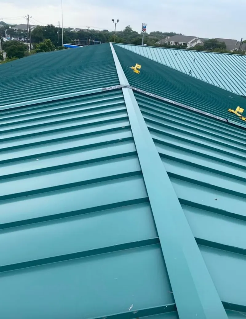 Green commercial metal roof ridge and valley for Metal Roof Repair in Fort Polk South