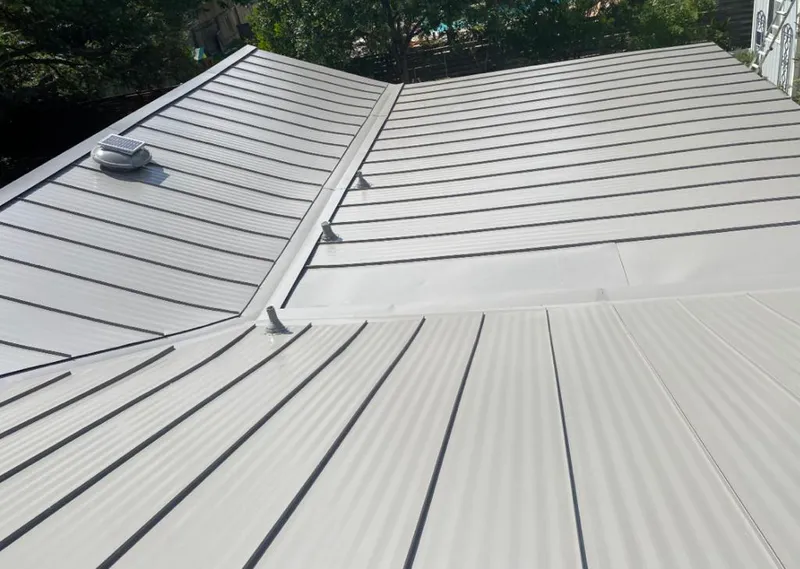 Solar attic fan installed on a metal roof for Roof Ventilation in Fort Polk South